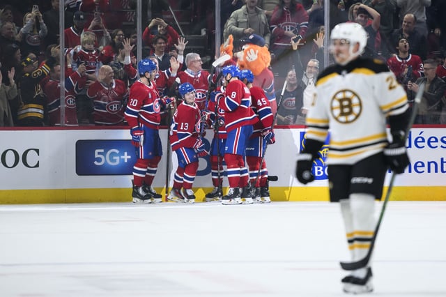 Montreal Canadiens right wing Cole Caufield (13) celebrates with teammates after scoring during second period NHL hockey action against the Boston Bruins in Montreal, on Thursday, April 3, 2025. 