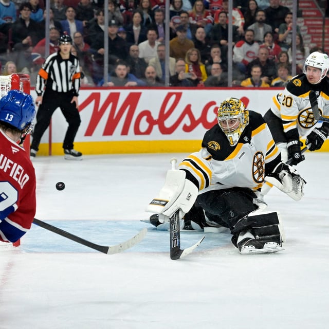 Apr 3, 2025; Montreal, Quebec, CAN; Montreal Canadiens forward Cole Caufield (13) scores a goal against Boston Bruins goalie Jeremy Swayman (1) during the second period at the Bell Centre. Mandatory Credit: Eric Bolte-Imagn Images