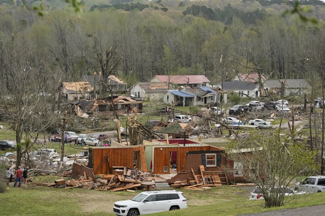 Storm damaged homes are seen Thursday, April 3, 2025, in Selmer, Tenn. (AP Photo/George Walker IV)