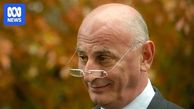 Man looking over his reading glasses