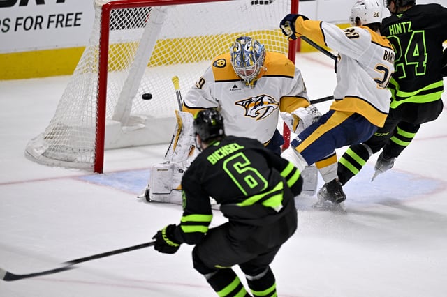 Apr 3, 2025; Dallas, Texas, USA; Dallas Stars defenseman Lian Bichsel (6) scores a goal against Nashville Predators goaltender Justus Annunen (29) during the third period at the American Airlines Center. Mandatory Credit: Jerome Miron-Imagn Images