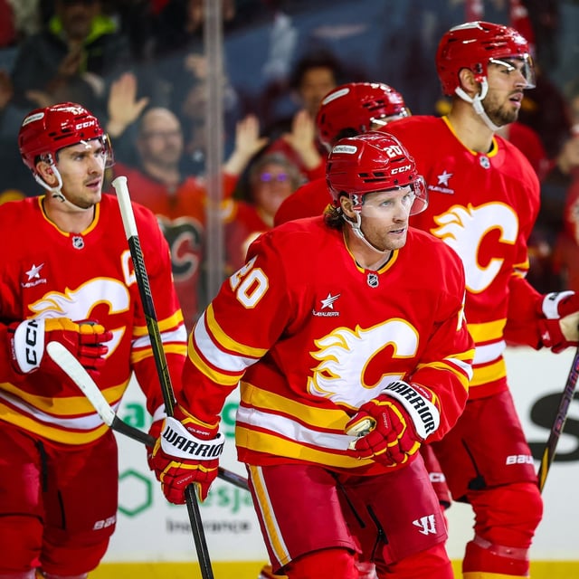 Apr 3, 2025; Calgary, Alberta, CAN; Calgary Flames left wing Blake Coleman (20) celebrates his goal with teammates against the Anaheim Ducks during the second period at Scotiabank Saddledome. Mandatory Credit: Sergei Belski-Imagn Images