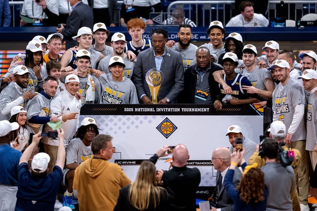 INDIANAPOLIS, INDIANA - APRIL 03: Chattanooga Mocs players celebrate the team's victory after the championship game against the UC Irvine Anteaters in the 2025 Men's National Invitation Tournament at Hinkle Fieldhouse on April 3, 2025 in Indianapolis, Indiana. (Photo by Doug McSchooler/NCAA Photos via Getty Images)