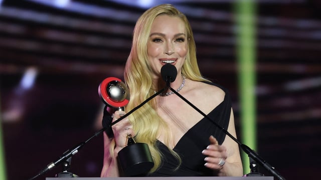 US actress Lindsay Lohan holds her CinemaCon Vanguard Award as she speaks on stage during the CinemaCon 2025 Big Screen Achievement Awards at Omnia Nightclub at Caesars Palace in Las Vegas, Nevada on April 3, 2025. (Photo by VALERIE MACON / AFP)