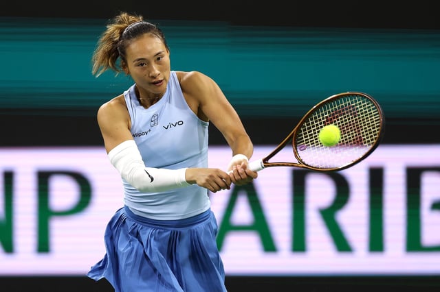 INDIAN WELLS, CALIFORNIA - MARCH 11: Qinwen Zheng of China returns a shot to Marta Kostyuk of Ukraine during the BNP Paribas Open at Indian Wells Tennis Garden on March 11, 2025 in Indian Wells, California. (Photo by Matthew Stockman/Getty Images)