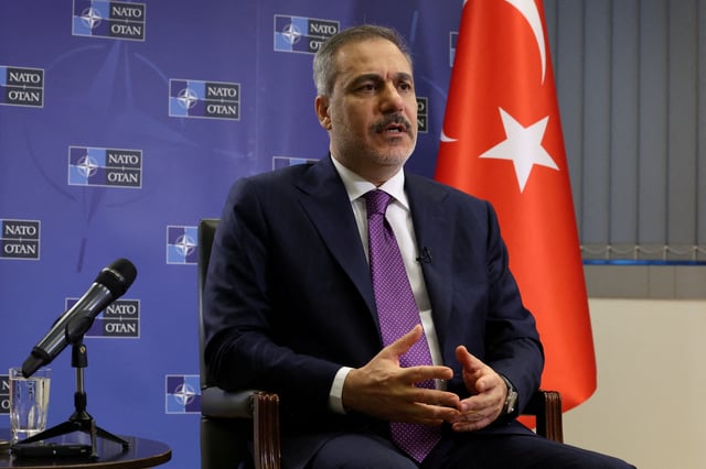 Turkish Foreign Minister Hakan Fidan attends an interview with Reuters, in Brussels, Belgium April 4, 2025. REUTERS/Yves Herman