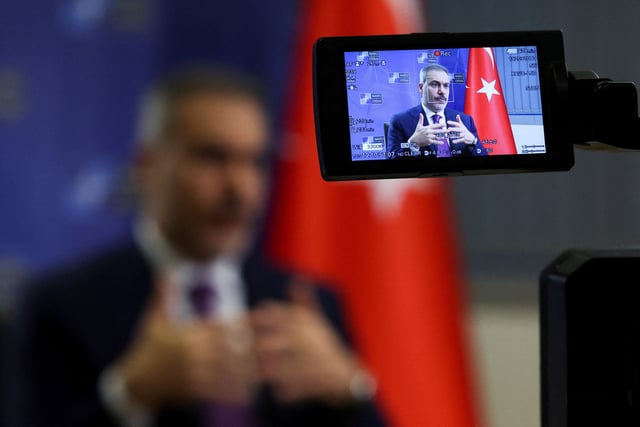 Turkish Foreign Minister Hakan Fidan attends an interview with Reuters, in Brussels, Belgium April 4, 2025. REUTERS/Yves Herman