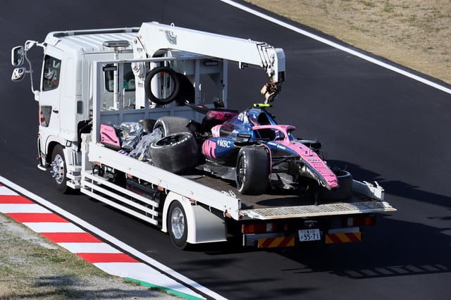 Formula One F1 - Japanese Grand Prix - Suzuka Circuit, Suzuka, Japan - April 4, 2025 The car of Alpine's Jack Doohan is towed away by marshals after his crash during practice REUTERS/Issei Kato