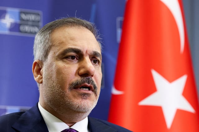 Turkish Foreign Minister Hakan Fidan attends an interview with Reuters, in Brussels, Belgium April 4, 2025. REUTERS/Yves Herman