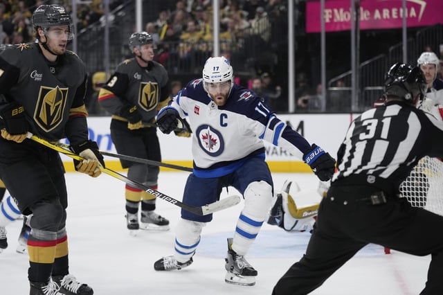 Winnipeg Jets center Adam Lowry (17) celebrates after scoring against the Vegas Golden Knights during the first period of an NHL hockey game Thurs., April 3, 2025, in Las Vegas. (AP Photo/John Locher)