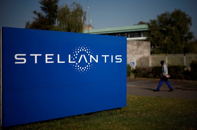 A man walks past a logo of Stellantis outside the company's building in Chartres-de-Bretagne near Rennes, France, September 20, 2024. REUTERS/Stephane Mahe/Fle Photo