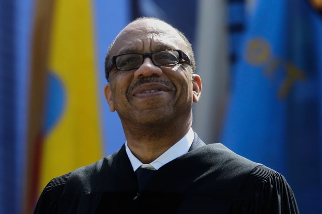 FILE - Eugene Robinson, Pulitzer Prize-winning journalist and author, smiles while receiving the honorary Doctor of Humane Letters at the University of Michigan commencement at Michigan Stadium in Ann Arbor, Mich., Saturday, April 30, 2011. (AP Photo/Paul Sancya, File)