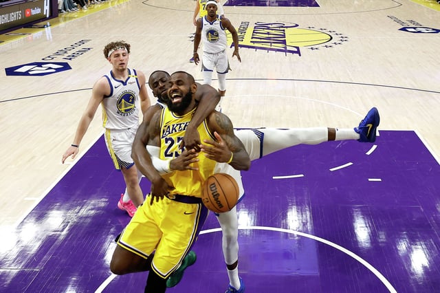 LeBron James of the Los Angeles Lakers reacts as he’s fouled by Draymond Green of the Golden State Warriors during the second half of a game at Crypto.com Arena on April 3, 2025, in Los Angeles.