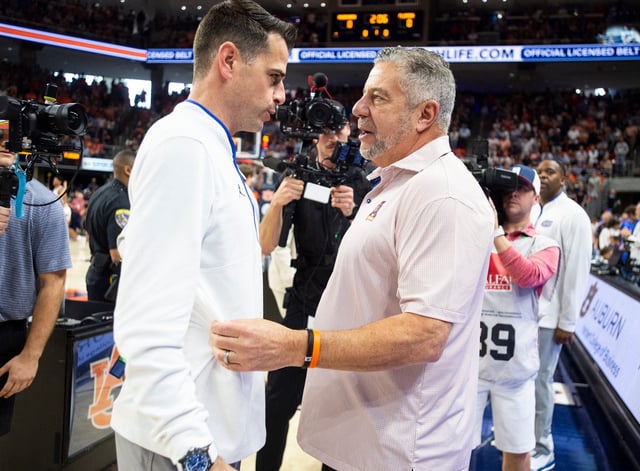 Florida coach Todd Golden, left, and Auburn coach Bruce Pearl talk before their game at Neville Arena in Auburn, Ala., on Saturday, Feb. 8, 2025.