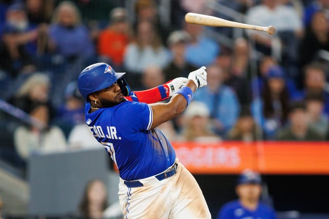Vladimir Guerrero Jr. #27 of the Toronto Blue Jays loses his bat as he swings in the ninth inning of their MLB game against the Baltimore Orioles at Rogers Centre on March 29, 2025 in Toronto, Ontario, Canada.