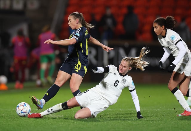 Soccer Football - Women's Nations League - League A - Scotland v Germany - Tannadice Park, Dundee, Scotland, Britain - April 4, 2025  Scotland's Kirsty Hanson in action with Germany's Janina Minge REUTERS/Russell Cheyne