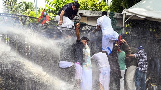 Water cannons being used to disperse Bharatiya Janata Yuva Morcha (BJYM) activists during their protest demanding the resignation of Kerala Chief Minister Pinarayi Vijayan following reports that his daughter, T Veena, has been named by the Serious Fraud Investigation Office (SFIO) in an illegal payment scandal, in Thiruvananthapuram, on Friday (PTI)