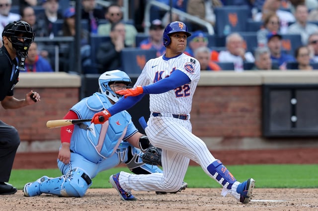 Apr 4, 2025; New York City, New York, USA; New York Mets right fielder Juan Soto (22) follows through on an RBI double against the Toronto Blue Jays during the sixth inning at Citi Field. Mandatory Credit: Brad Penner-Imagn Images