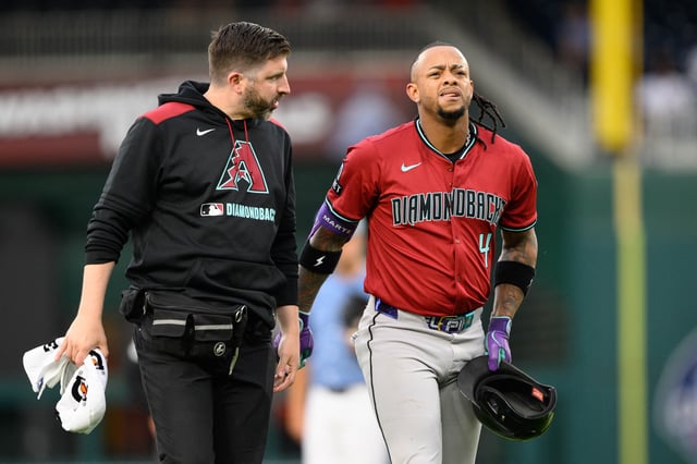 Apr 4, 2025; Washington, District of Columbia, USA; Arizona Diamondbacks second base Ketel Marte (4) reacts after injuring his leg during the first inning against the Washington Nationals at Nationals Park. Mandatory Credit: Reggie Hildred-Imagn Images