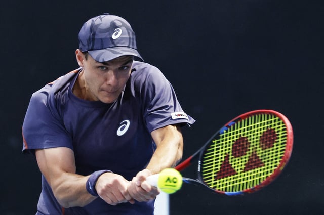 Tennis - Australian Open - Melbourne Park, Melbourne, Australia - January 14, 2025 Poland's Kamil Majchrzak in action during his first round match against Spain's Pablo Carreno Busta REUTERS/Tingshu Wang/File Photo