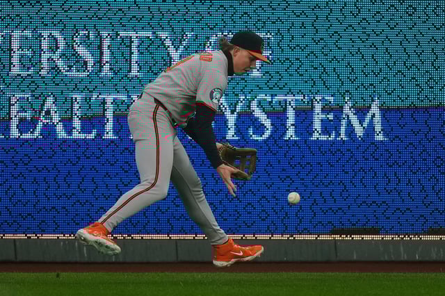 Baltimore Orioles left fielder Heston Kjerstad fields an RBI double hit by Kansas City Royals&#39; Salvador Perez during the first inning of a baseball game, Friday, April 4, 2025, in Kansas City, Mo. (AP Photo/Charlie Riedel)