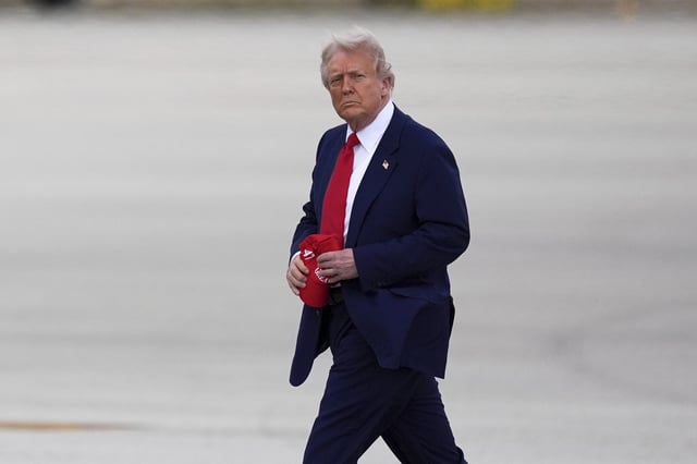 President Donald Trump arrives at Miami International Airport, Thursday, April 3, 2025, in Miami. (AP Photo/Rebecca Blackwell)