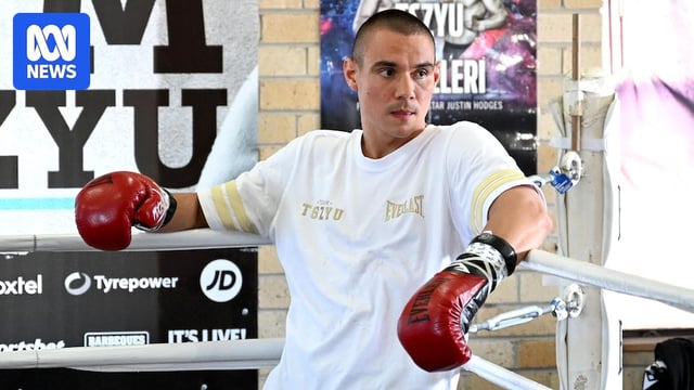 Tim Tszyu leans on the ring ropes