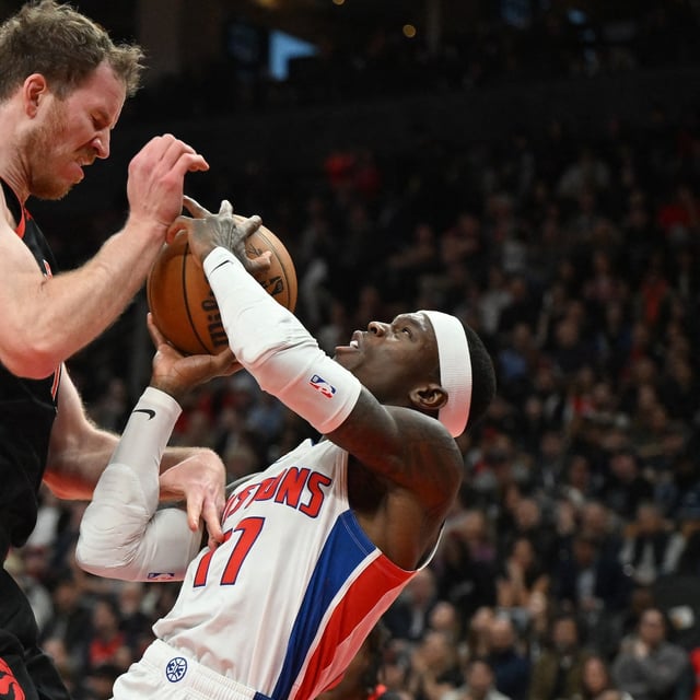 Apr 4, 2025; Toronto, Ontario, CAN;  Toronto Raptors center Jakob Poeltl (19) collides with Detroit Pistons guard Dennis Schroder (17) in the first half at Scotiabank Arena. Mandatory Credit: Dan Hamilton-Imagn Images