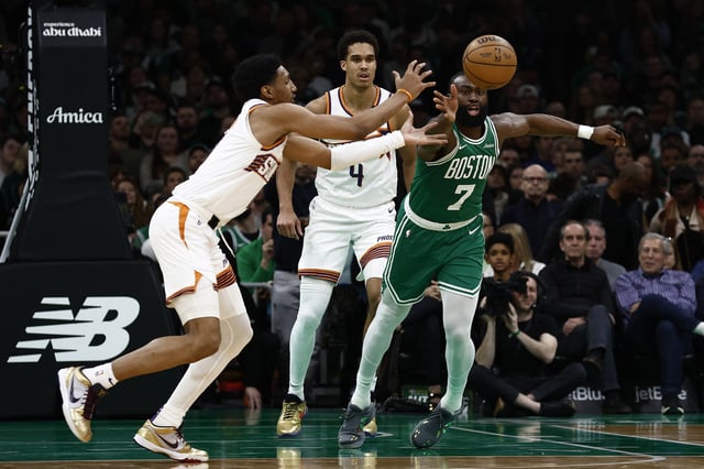 Apr 4, 2025; Boston, Massachusetts, USA; Boston Celtics guard Jaylen Brown (7) and Phoenix Suns forward Ryan Dunn (0) go for a loose ball during the second half at TD Garden. Mandatory Credit: Winslow Townson-Imagn Images