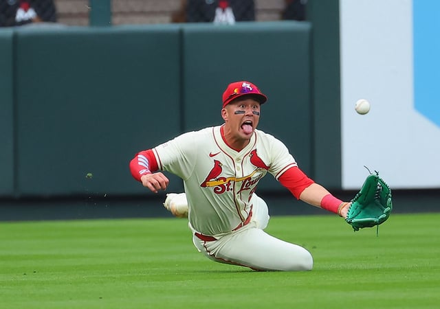 ST LOUIS, MISSOURI - MARCH 29: Lars Nootbaar #21 of the St. Louis Cardinals catches a fly ball against the Minnesota Twins in the second inning at Busch Stadium on March 29, 2025 in St Louis, Missouri.