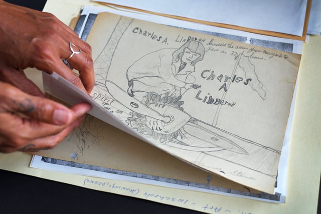 Dr. Tru Leverette looks through student drawings which are included in the collection of writings by Viola Muse. He was awarded a $100,000 National Endowment for the Humanities grant for the project, "Documenting Black Jacksonville: The Viola Muse Digital Edition."
