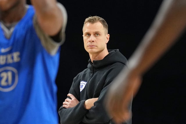 Duke coach Jon Sheyer watches the Blue Devils practice Friday at the Alamodome.