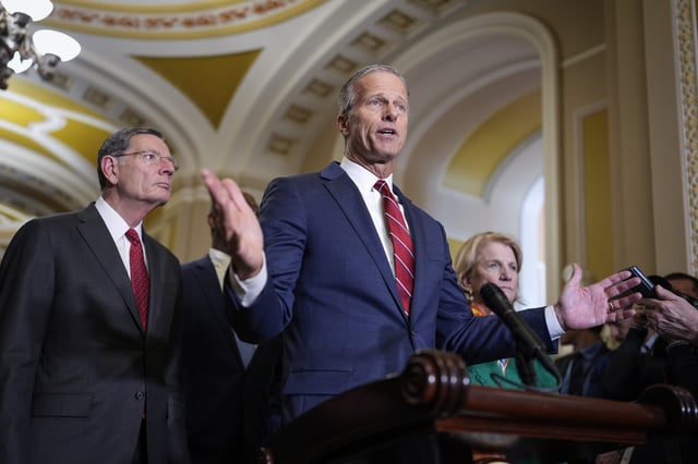 Senate Majority Leader John Thune, R-S.D., joined by Sen. John Barrasso, R-Wyo., the GOP whip, left, talks to reporters ahead of announcements by President Donald Trump on tariffs, at the Capitol, in Washington, Tuesday, April 1, 2025. (AP Photo/J. Scott Applewhite)