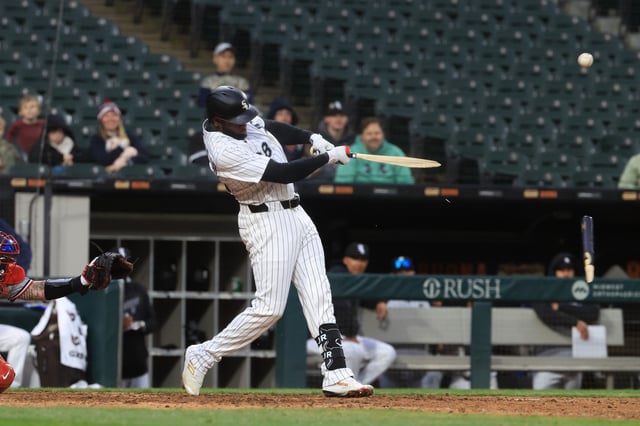 CHICAGO, ILLINOIS - APRIL 02: Luis Robert Jr. #88 of the Chicago White Sox breaks his bat as he hits a single during the eighth inning against the Minnesota Twins at Rate Field on April 02, 2025 in Chicago, Illinois.