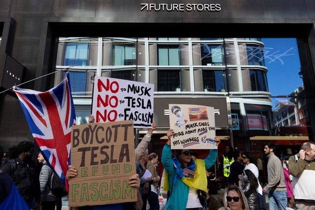 Demonstrators protest against Tesla CEO Elon Musk outside the new Tesla dealership in London, Britain, April 5, 2025. REUTERS/Carlos Jasso