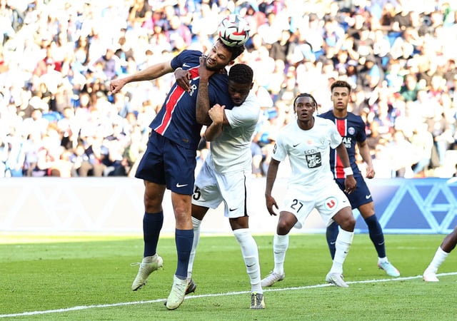 Soccer Football - Ligue 1 - Paris St Germain v Angers - Parc des Princes, Paris, France - April 5, 2025 Paris St Germain's Goncalo Ramos in action with Angers' Abdoulaye Bamba REUTERS/Gonzalo Fuentes