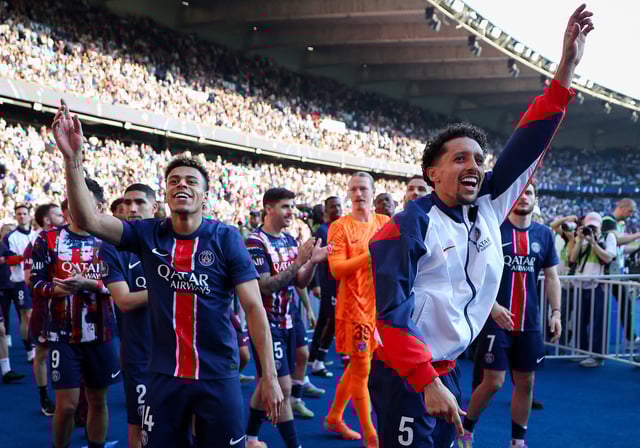 Soccer Football - Ligue 1 - Paris St Germain v Angers - Parc des Princes, Paris, France - April 5, 2025 Paris St Germain's Desire Doue and Paris St Germain's Marquinhos celebrate after winning Ligue 1 Pool via REUTERS/Franck Fife