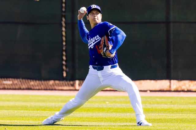 The Dodgers’ Shohei Ohtani, seen throwing before a spring training game against the Athletics on March 9, 2025, in Glendale, Arizona, has ramped up his program in hopes of pitching in a couple of months. (Photo by John E. Moore III/Getty Images)