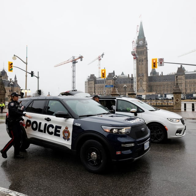 Police secure the perimeter of Canada's Parliament after declaring a lockdown, in Ottawa on April 5.