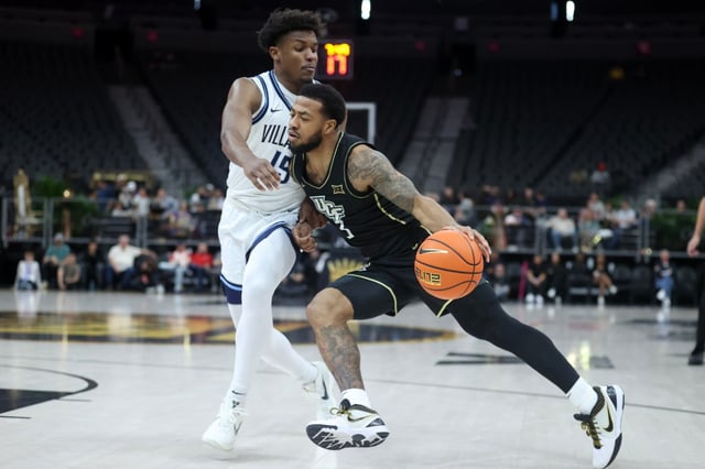 LAS VEGAS, NEVADA - APRIL 05: Darius Johnson #3 of the UCF Knights drives against Jordan Longino #15 of the Villanova Wildcats in the first half of a semifinal game of the College Basketball Crown tournament at T-Mobile Arena on April 05, 2025 in Las Vegas, Nevada. (Photo by Ian Maule/Getty Images)