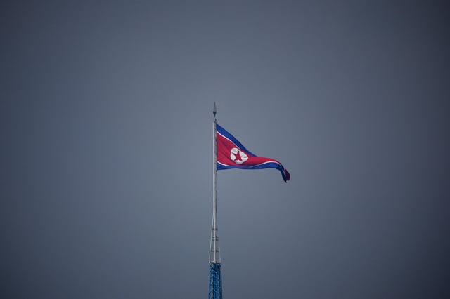A North Korean flag flutters at the propaganda village of Gijungdong in North Korea, in this picture taken near the truce village of Panmunjom inside the demilitarized zone (DMZ) separating the two Koreas, South Korea, July 19, 2022.    REUTERS/Kim Hong-Ji/Pool/File Photo