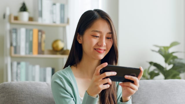 Woman playing on her phone.