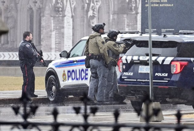 Members of the Ottawa police service investigate an incident at Parliament Hill in Ottawa on Saturday April 5, 2025. 