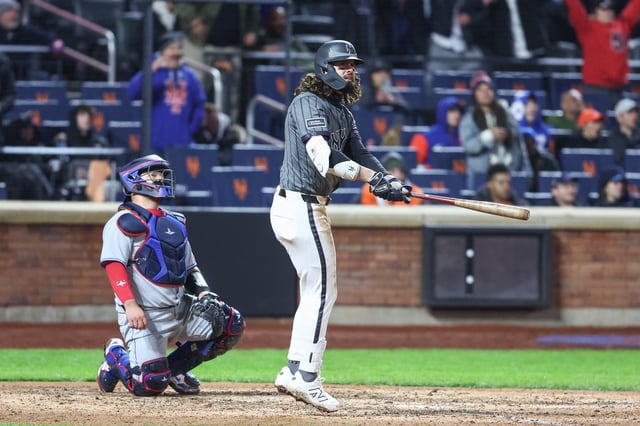 Apr 5, 2025; New York City, New York, USA;  New York Mets designated hitter Jesse Winker (3) hits a two-run triple in the eighth inning against the Toronto Blue Jays at Citi Field. Mandatory Credit: Wendell Cruz-Imagn Images