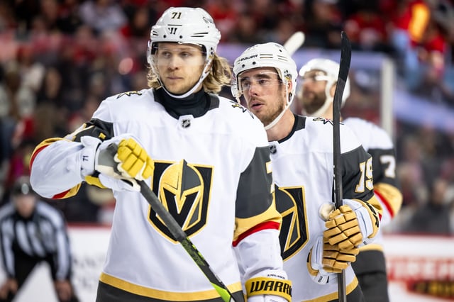 Apr 5, 2025; Calgary, Alberta, CAN; Vegas Golden Knights center William Karlsson (71) and right wing Reilly Smith (19) get ready for a faceoff during the third period at Scotiabank Saddledome. Mandatory Credit: Brett Holmes-Imagn Images