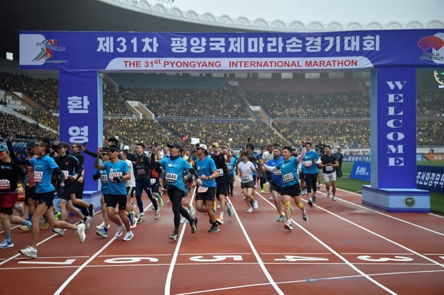 Participants take part in the 31st Pyongyang International Marathon at Kim Il Sung Stadium in Pyongyang on April 6, 2025, as part of celebrations marking the birth of North Korea's founding leader Kim Il Sung in 1912. The last edition of the Pyongyang Marathon was held in 2019 before the pandemic, during which the nuclear-armed state sealed its borders in an effort to contain the virus.