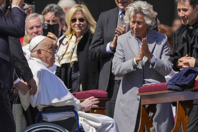 Pope Francis is cheered at by faithful at the end of a mass in St. Peter's Square at The Vatican, Sunday, April 6, 2025, part of the jubilee of the sick and the health workers. (AP Photo/Andrew Medichini)