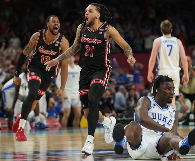 Houston guard Emanuel Sharp (21) and forward J'Wan Roberts (13) celebrate after their defeat of Duke in the national semifinals of the 2025 NCAA men's tournament at the Alamodome.
