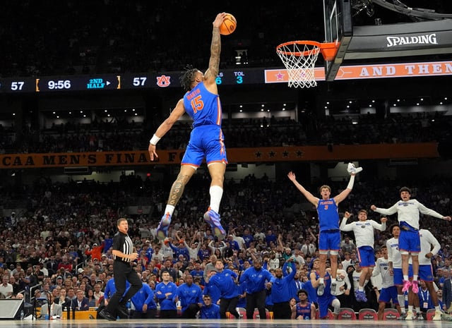 Apr 5, 2025; San Antonio, TX, USA; Florida Gators guard Alijah Martin (15) dunks the ball against the Auburn Tigers during the second half in the semifinals of the men's Final Four of the 2025 NCAA Tournament at the Alamodome. Mandatory Credit: Bob Donnan-Imagn Images