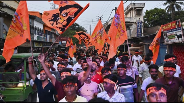 People take part in a religious procession on the occasion of Ram Navami, in Nadia, West Bengal, on Sunday. (PTI)
